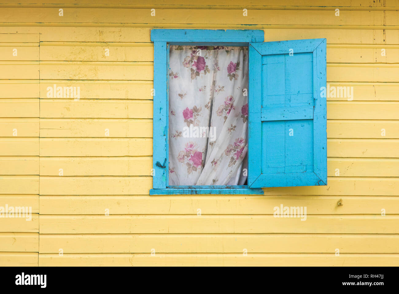 Detail shot of colorful wall and window in the Caribbean on the island of Roatan. Stock Photo