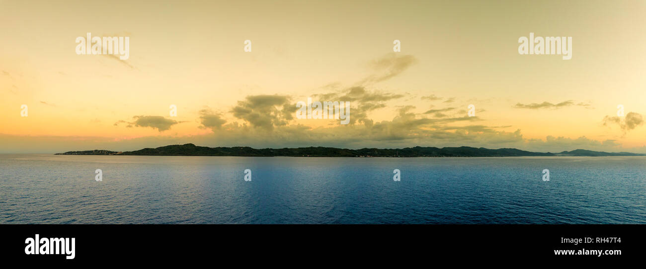 View of Roatan Island at first light, seen from the deck of a ship. Stock Photo