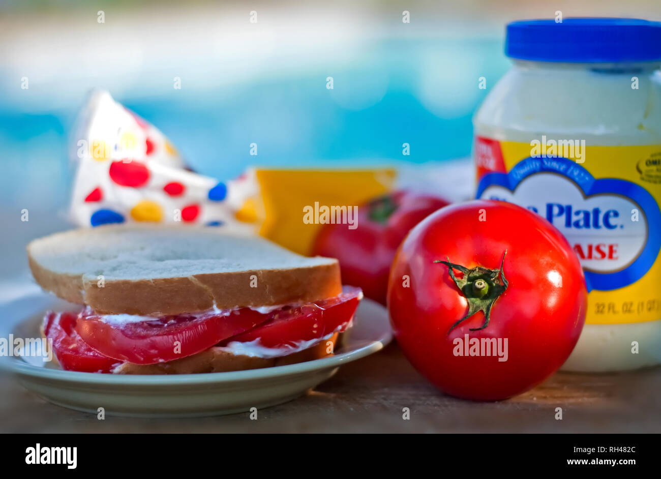 A fresh tomato sandwich, made with Wonder Bread and Blue Plate