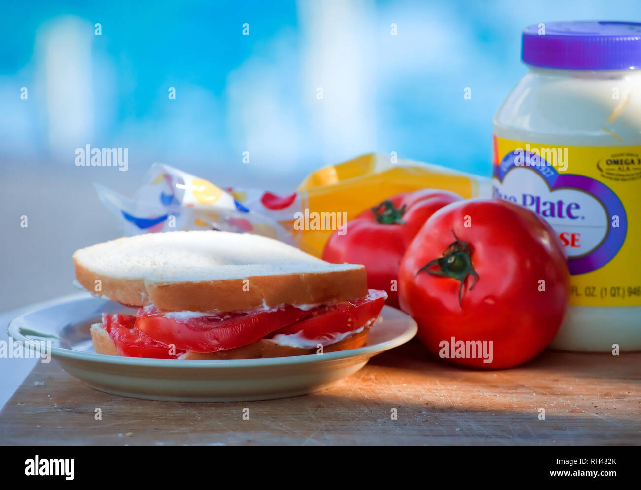 A fresh tomato sandwich, made with Wonder Bread and Blue Plate