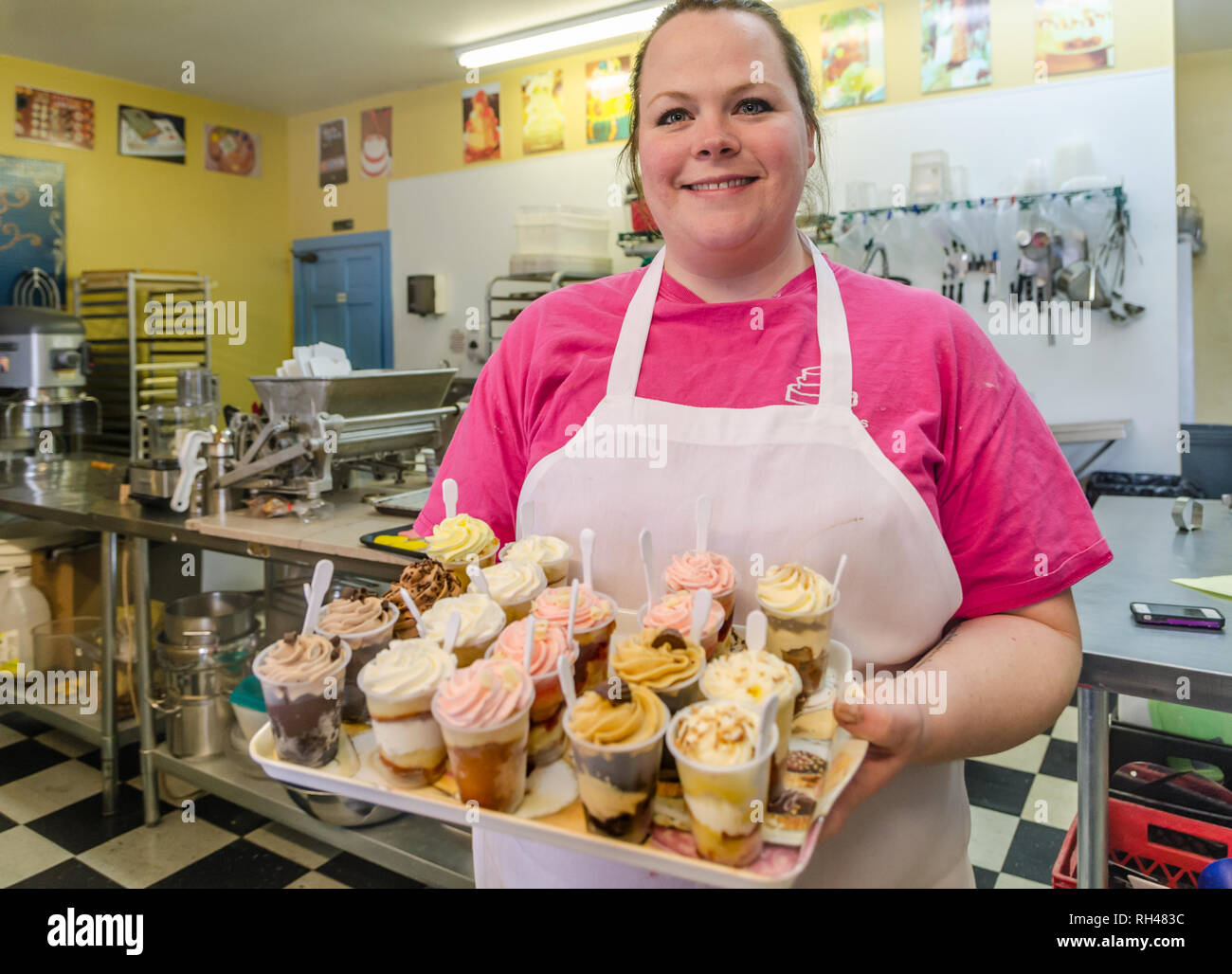 Cake decorator Sarah Hardin holds a tray of cake shots at Mary's Cakes & Pastries in Northport, Alabama, March 15, 2014. Stock Photo