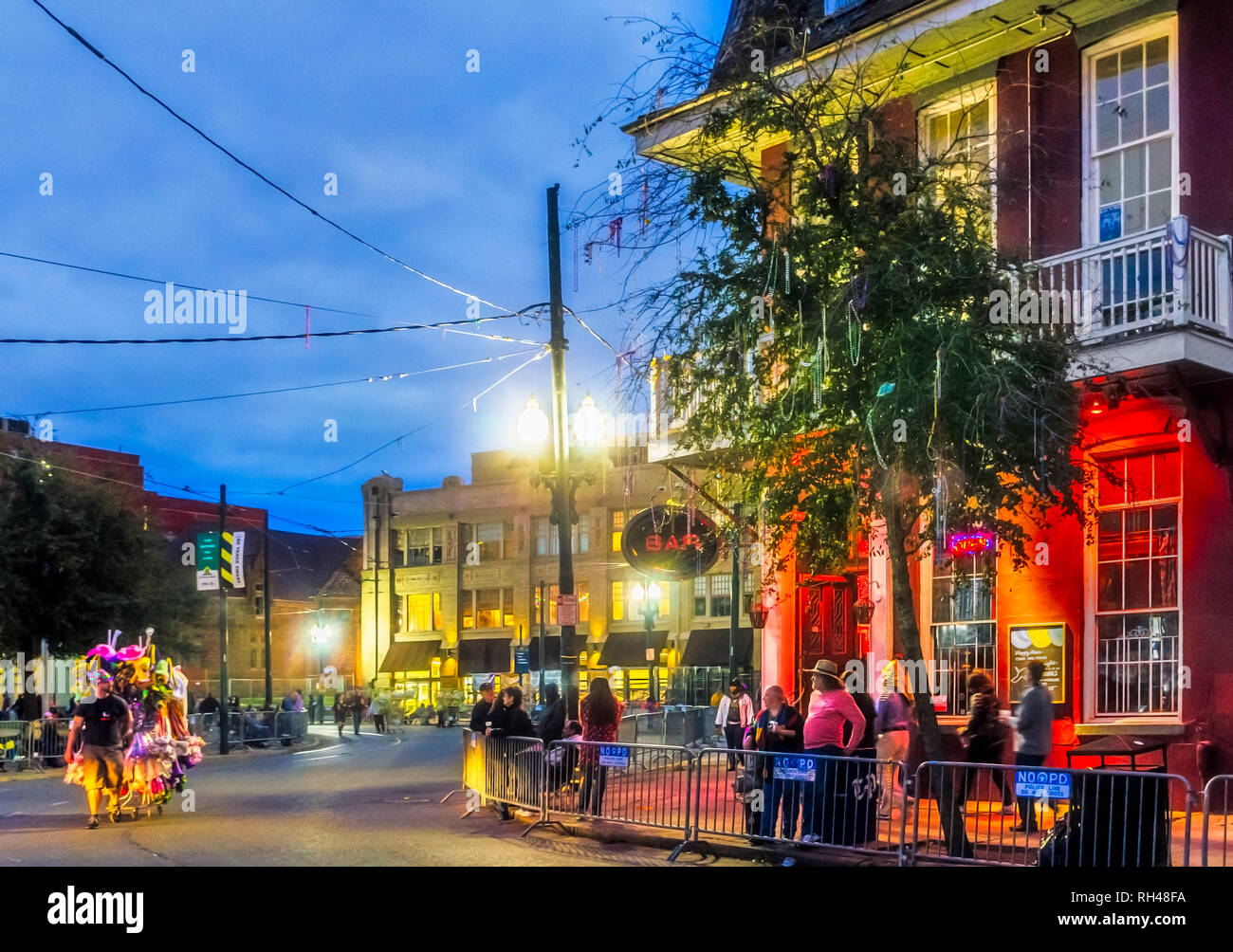 People wait outside Circle Bar for the Krewe of Hermes Mardi Gras parade at Lee Circle, Feb. 28, 2014, in New Orleans, Louisiana. Stock Photo