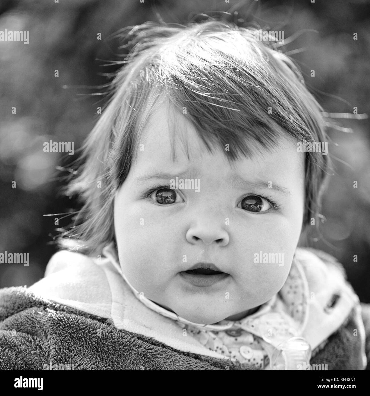 Small cute baby girl with pretty face and funny eyes outdoor on natural background closeup Stock Photo - Alamy Small cute baby girl with pretty face and funny eyes outdoor on natural background closeup Stock Photo - Alamy