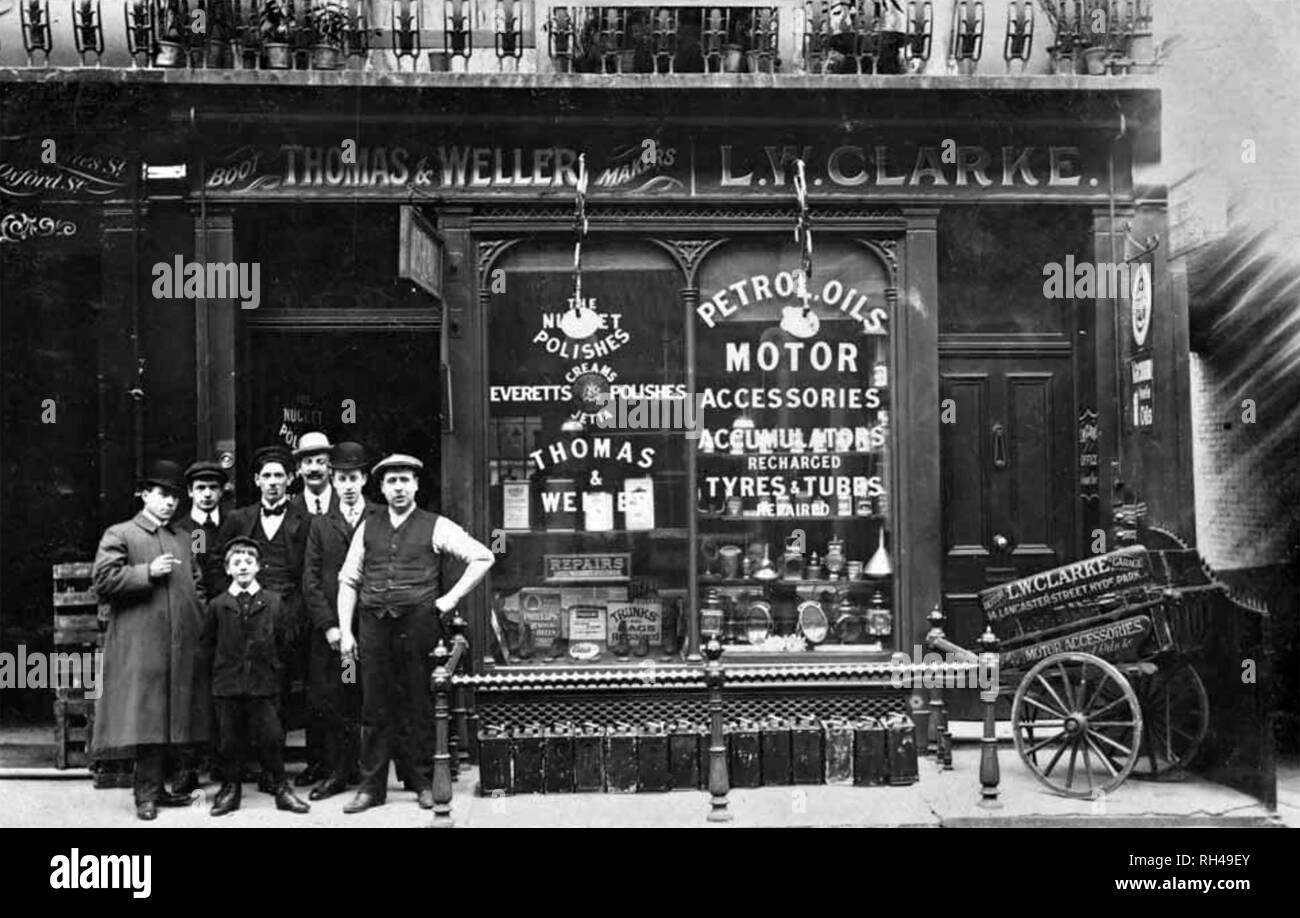 LONDON SHOP FRONT about 1905. Owner and staff of L.W.Clarke's automobile supply shop in Lancaster Street, near Hyde Park, posing proudly. Stock Photo