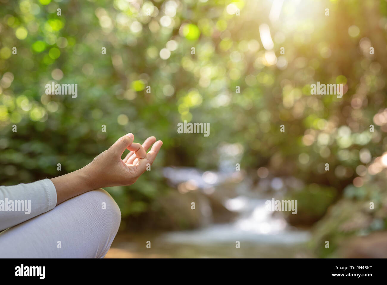 Beautiful girls are playing yoga at the park. Among the natural ...