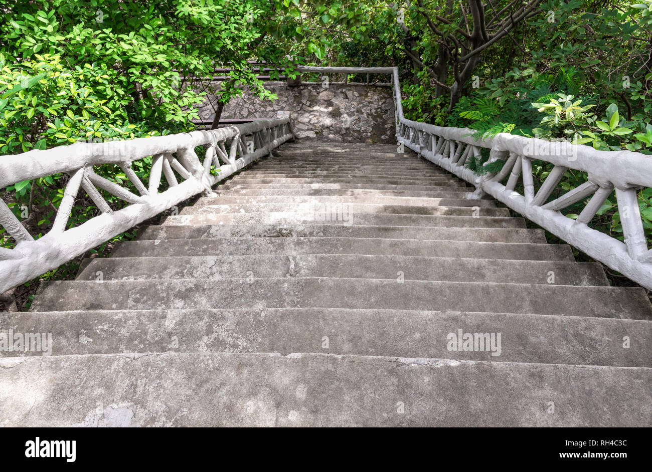 Concrete stairs on the hill leading down Stock Photo - Alamy