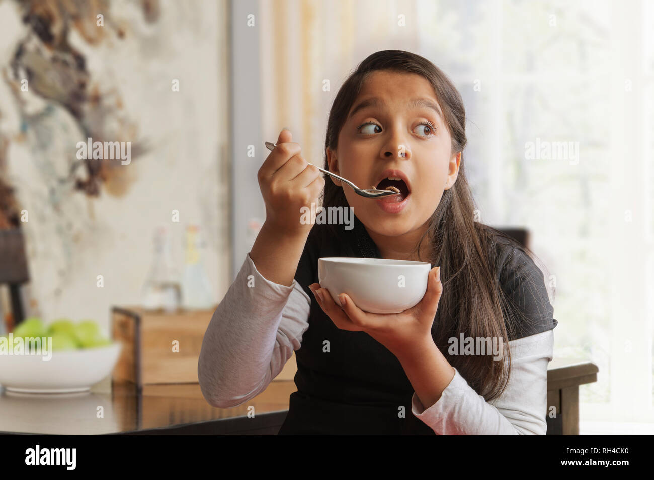 Indian girl eating breakfast hi-res stock photography and images - Alamy
