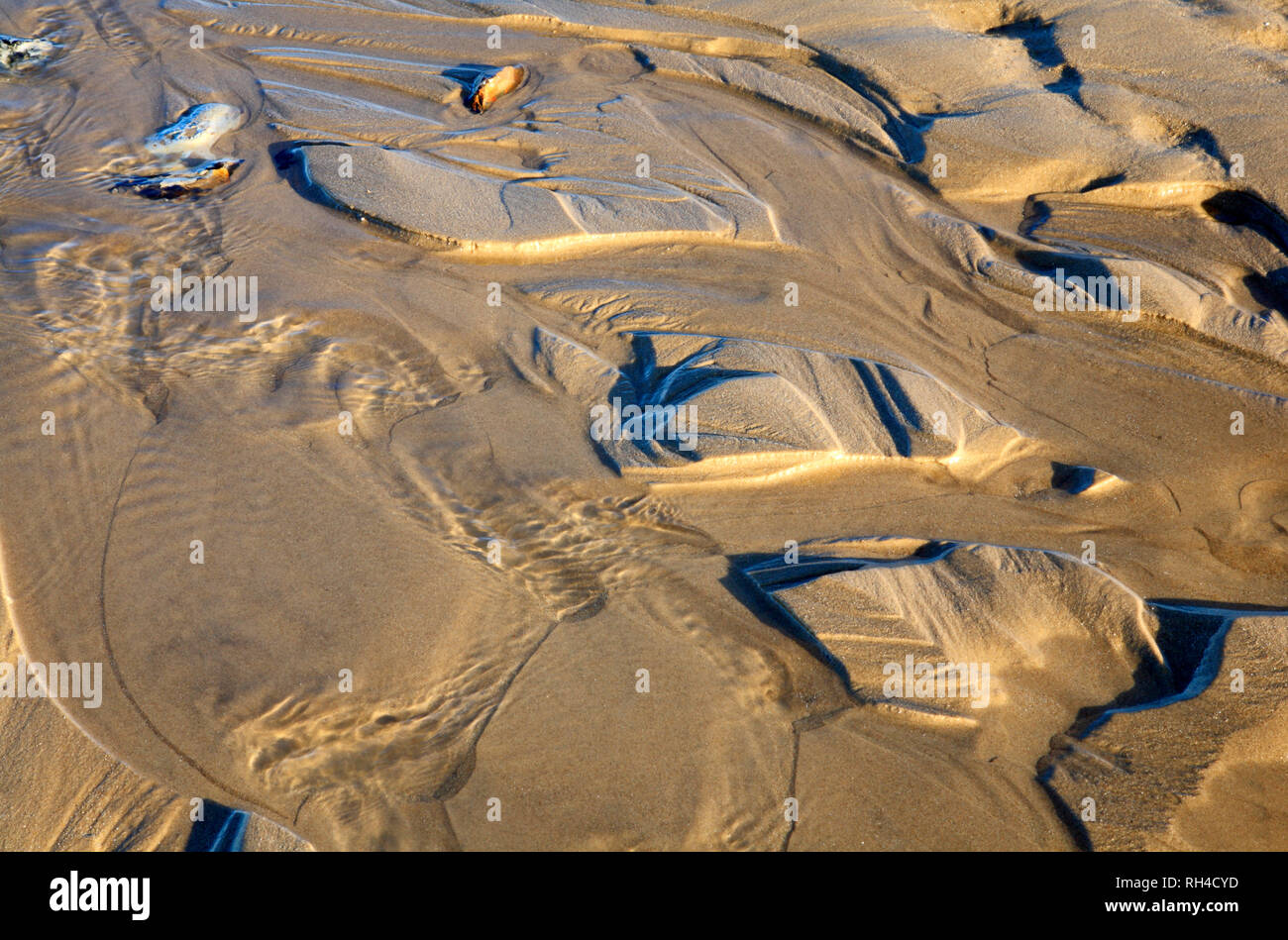 Patterns in the sand left by an ebbing tide on the beach at West Runton, Norfolk, England, United Kingdom, Europe. Stock Photo