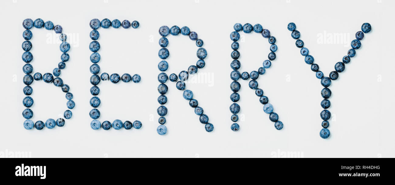 BERRY text arranged in blueberry fruit Stock Photo