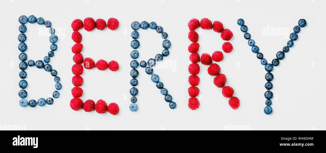 BERRY text arranged in blueberry and raspberry fruit Stock Photo