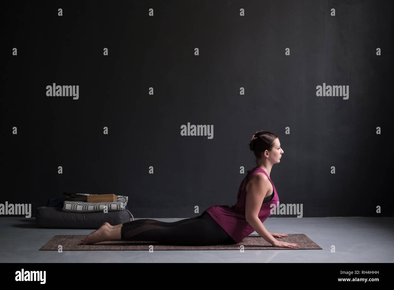Woman doing bhujangasana cobra pose hi-res stock photography and images ...