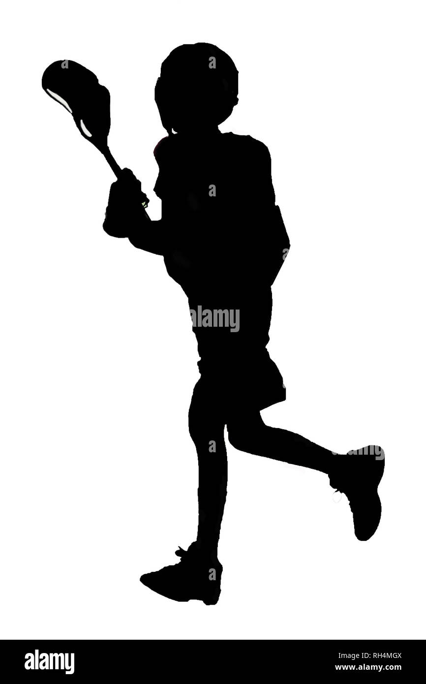 A silhouette of a boy running playing lacrosse. Stock Photo