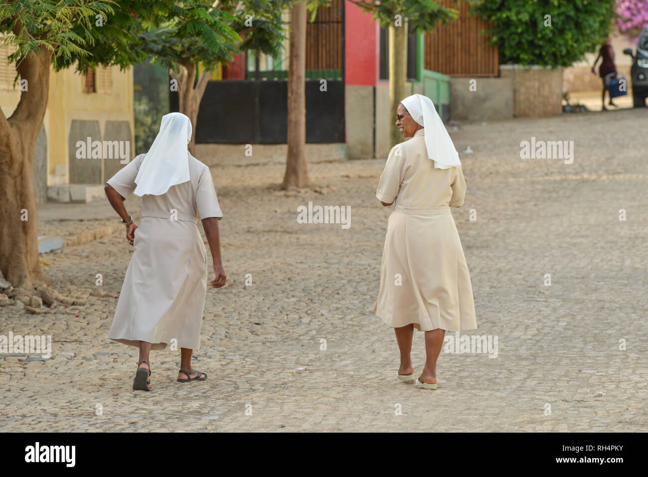 Cape Verde, Maio Island: two nuns walking in a street of the town of ...