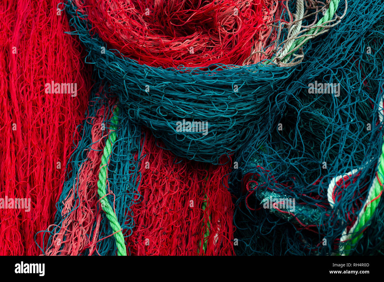Stacked fishing nets and ropes red, green, blue and white 6925047 Stock  Photo at Vecteezy