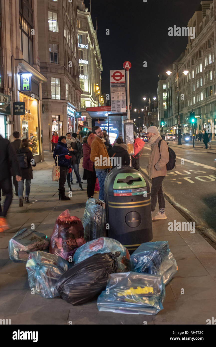 Rubbish at bus stop, Strand, London, UK Stock Photo