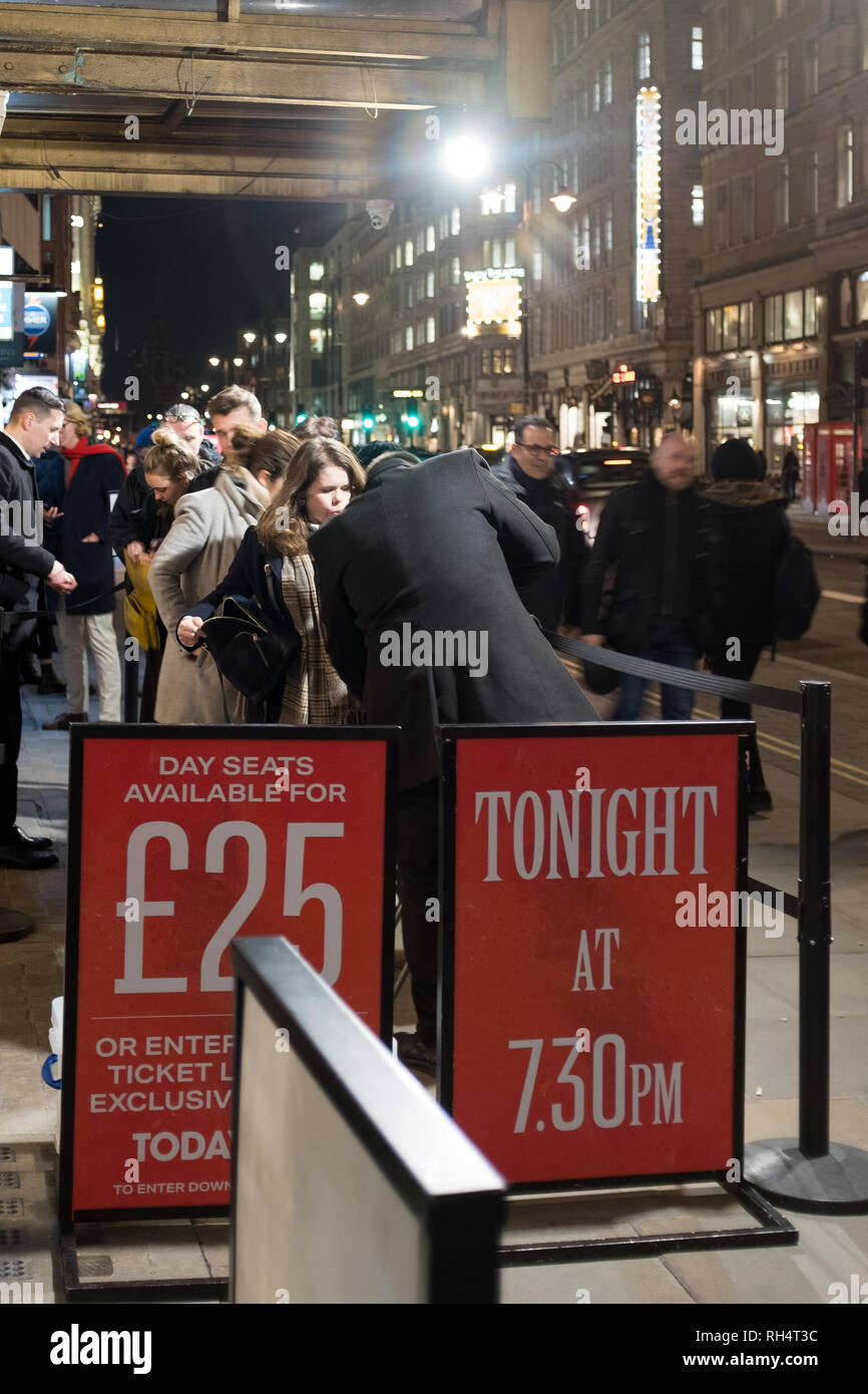 Evening queue outside the Vaudeville Theatre, Strand, London, UK Stock Photo
