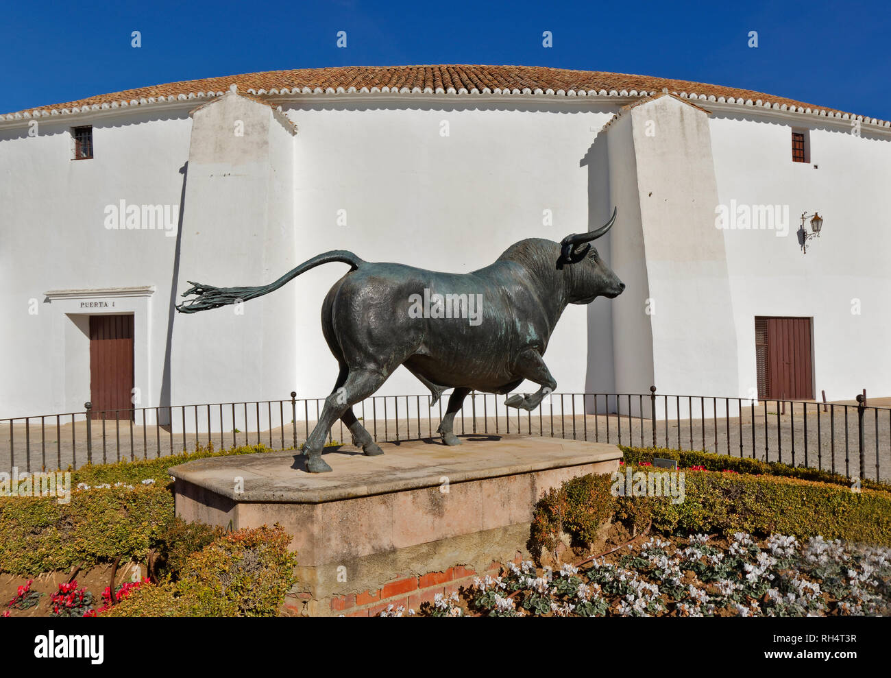 RONDA ANDALUCIA SPAIN THE BULLRING THE OLDEST IN SPAIN WITH STATUE OF A SPANISH BULL Stock Photo