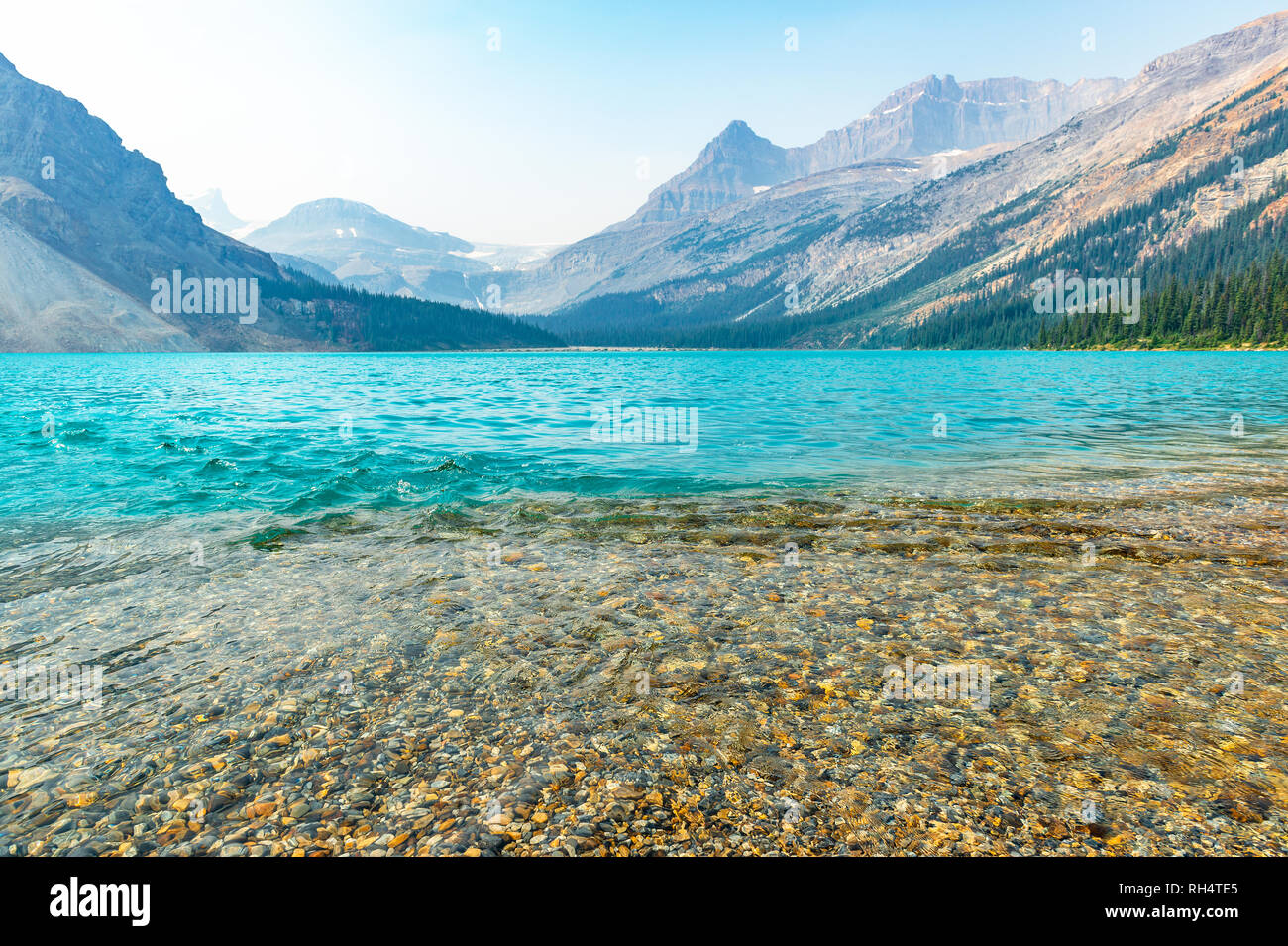 The magnificent turquoise glacier waters of Lake Louise mingling with pure transparent river waters in Banff National Park, Alberta, Canada. Stock Photo