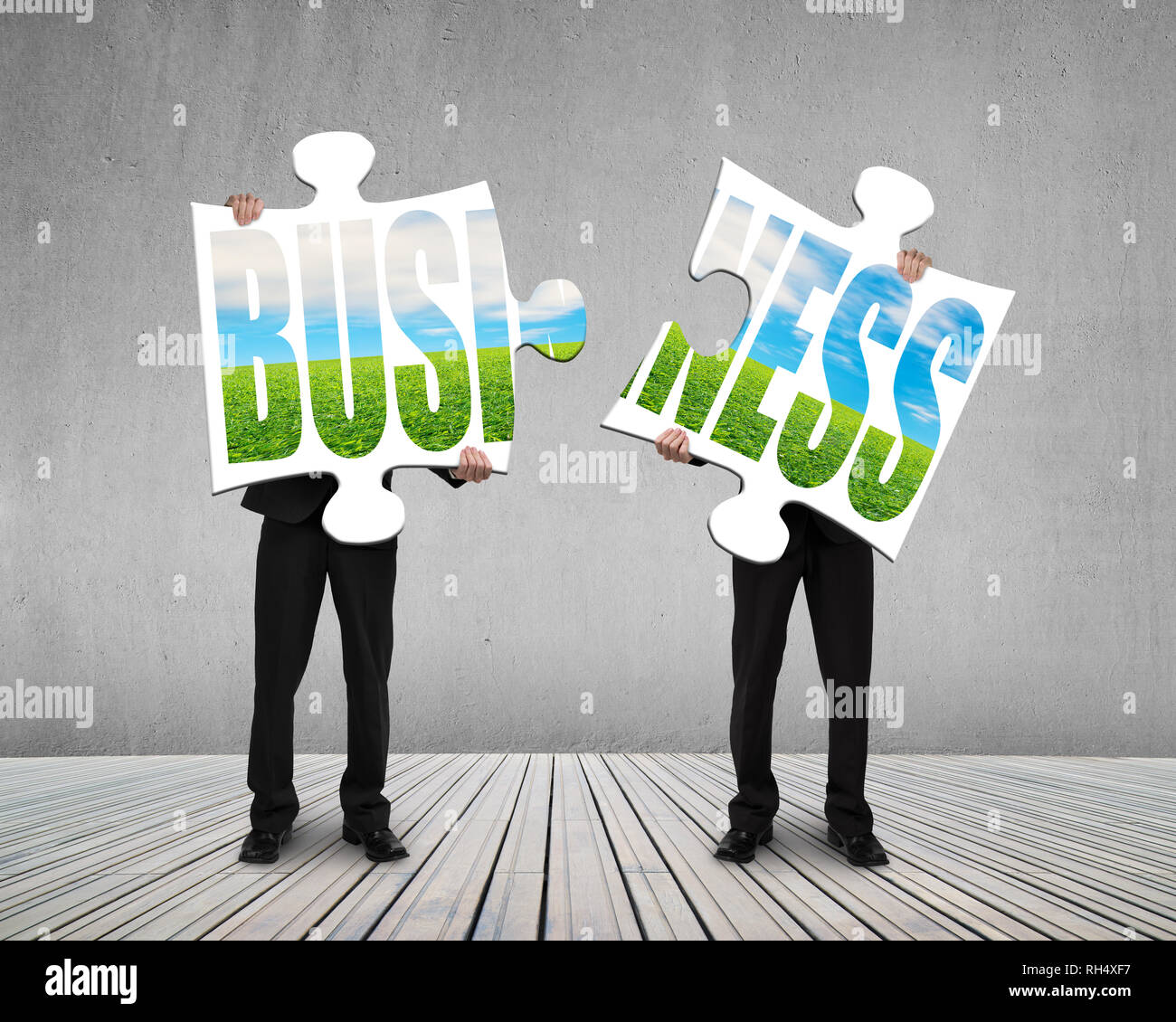Holding puzzles for assembling on wooden floor Stock Photo
