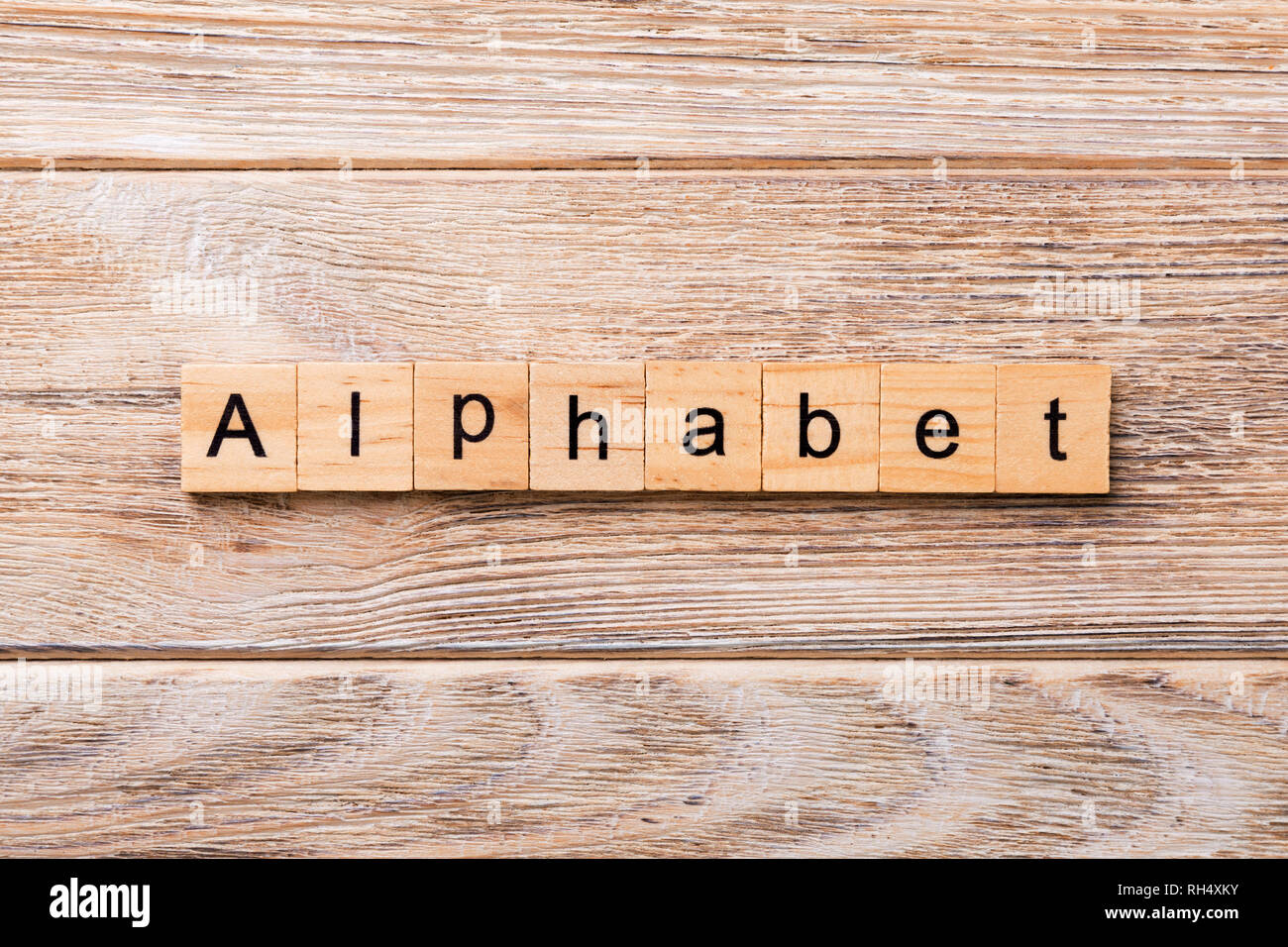 alphabet word written on wood block. alphabet text on wooden table for ...