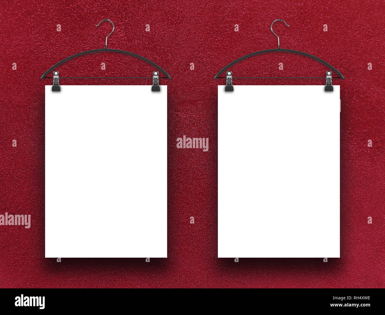 Two blank frames against red plaster wall background Stock Photo