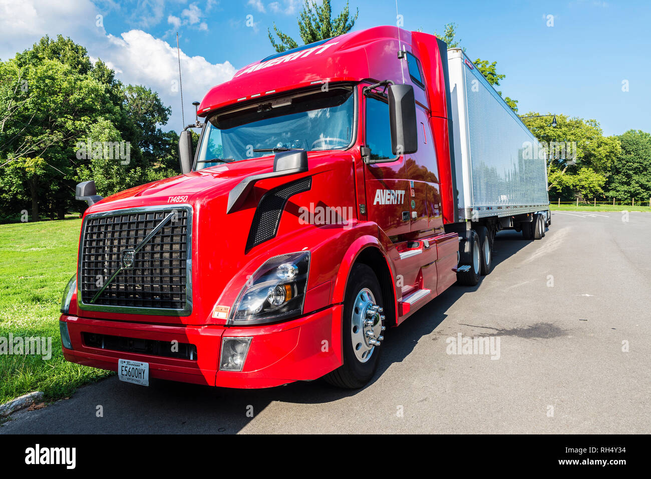 New York City, USA - July 26, 2018: Heavy red and white truck of the Volvo brand equipped with refrigeration goods parked in a Central Park, Manhattan Stock Photo
