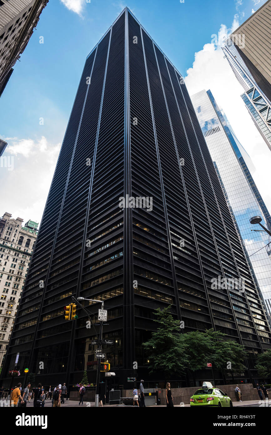 New York City, USA - July 26, 2018: Facade of Business Insider, modern black skyscraper, with people around in Manhattan in New York City, USA Stock Photo