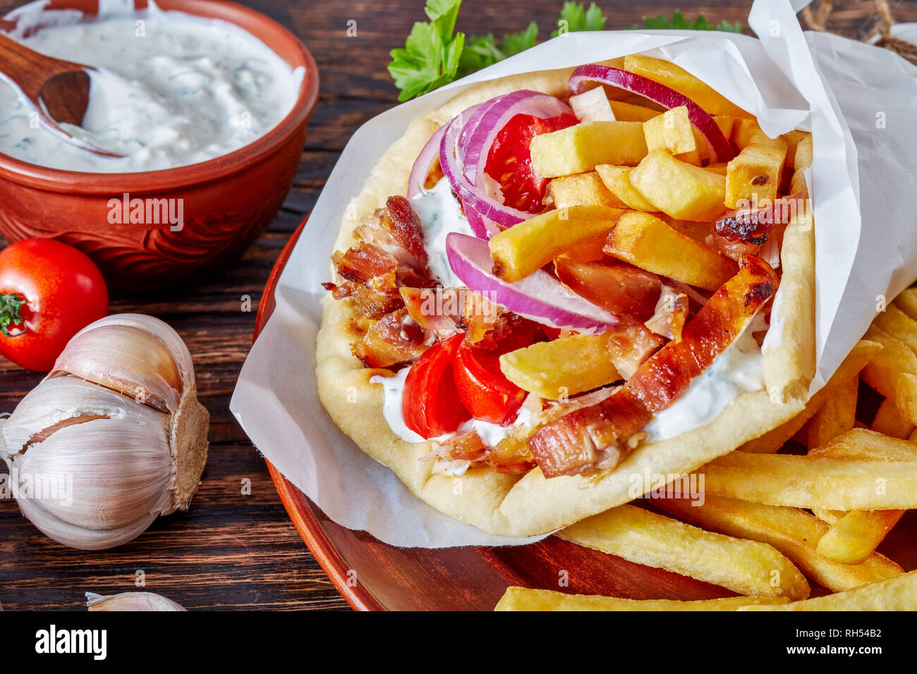 closeup of greek souvlaki, pita ma gyros with chicken meat, vegetables
