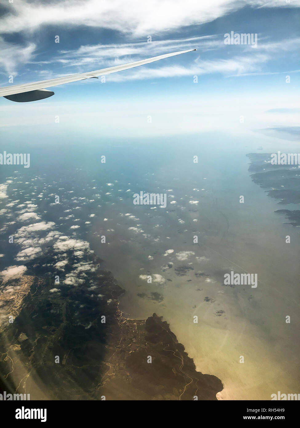 Landscape view from a window of a plane while in flight over Izmir city Turkey. Stock Photo