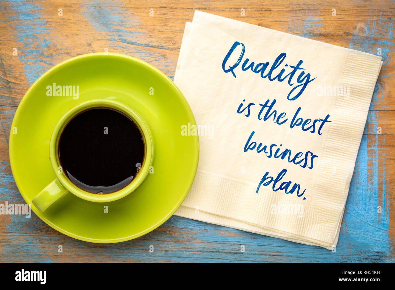 Quality is the best business plan - handwriting on a napkin with a cup of coffee Stock Photo
