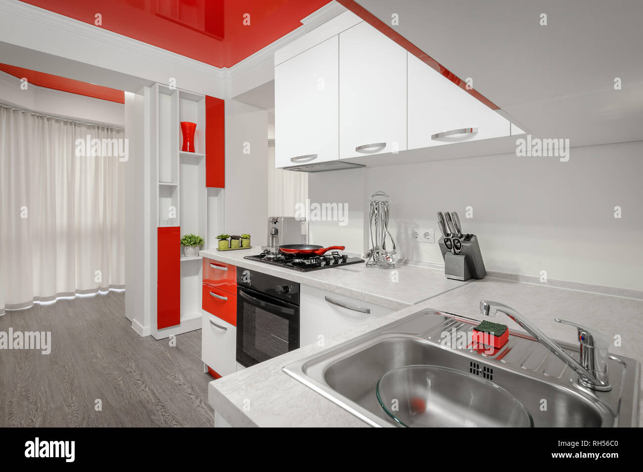 Modern red and white kitchen interior Stock Photo Alamy