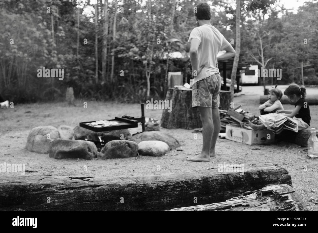 An australian style bush bbq with food cooking over a campfire with a