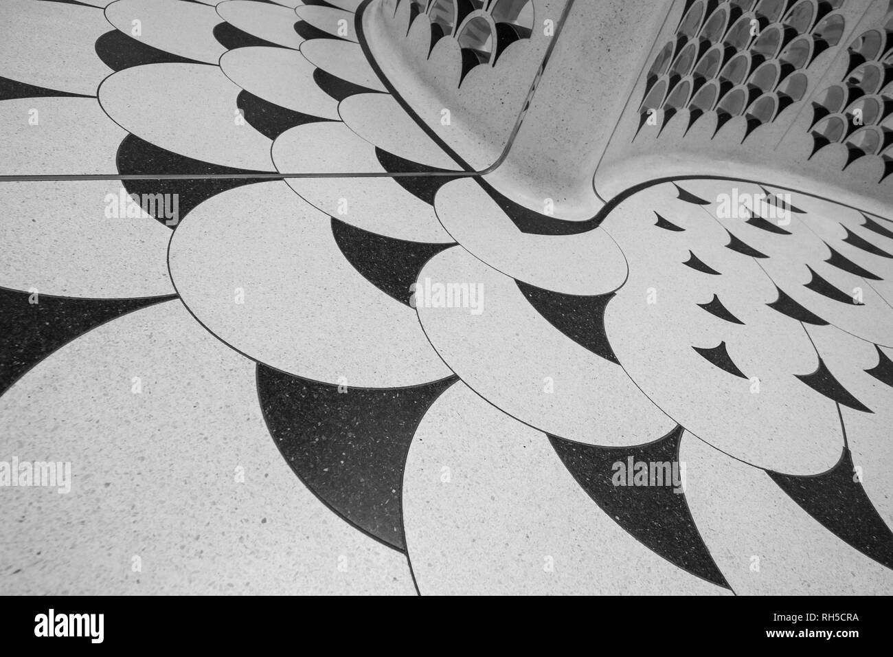 Detailed view of the spiral staircase and terrazzo floor around it, at Tate Britain art gallery on Millbank, London UK. Photographed in monochrome. Stock Photo