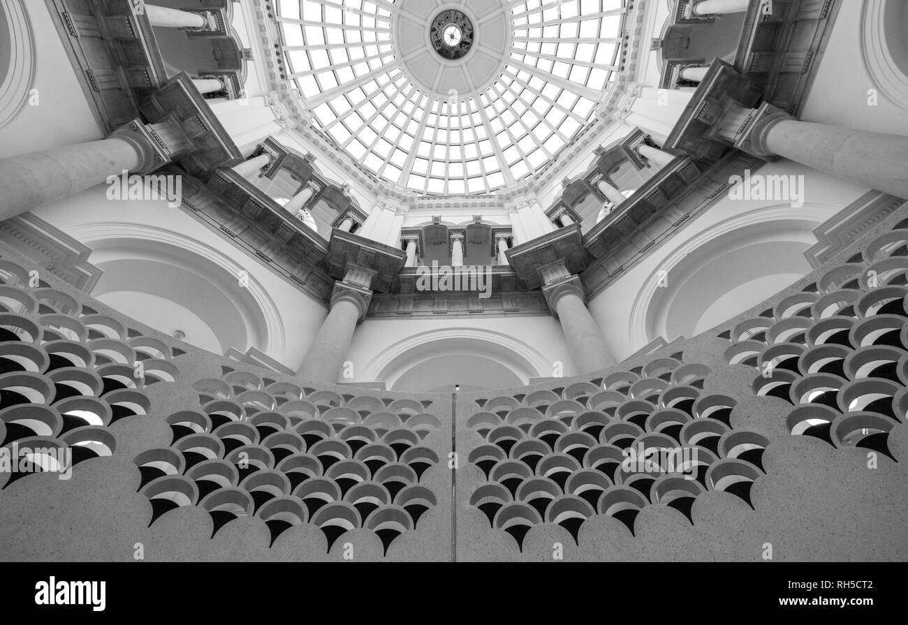 Detailed view of the spiral staircase at Tate Britain art gallery, with domed ceiling above. Photographed in monochrome. Stock Photo