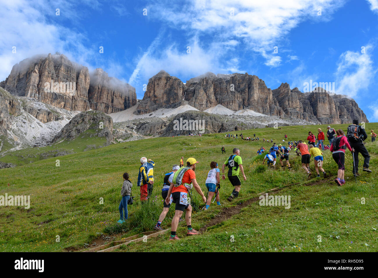 Participants in the Dolomites Skyrace running up the Sella Massif Stock Photo