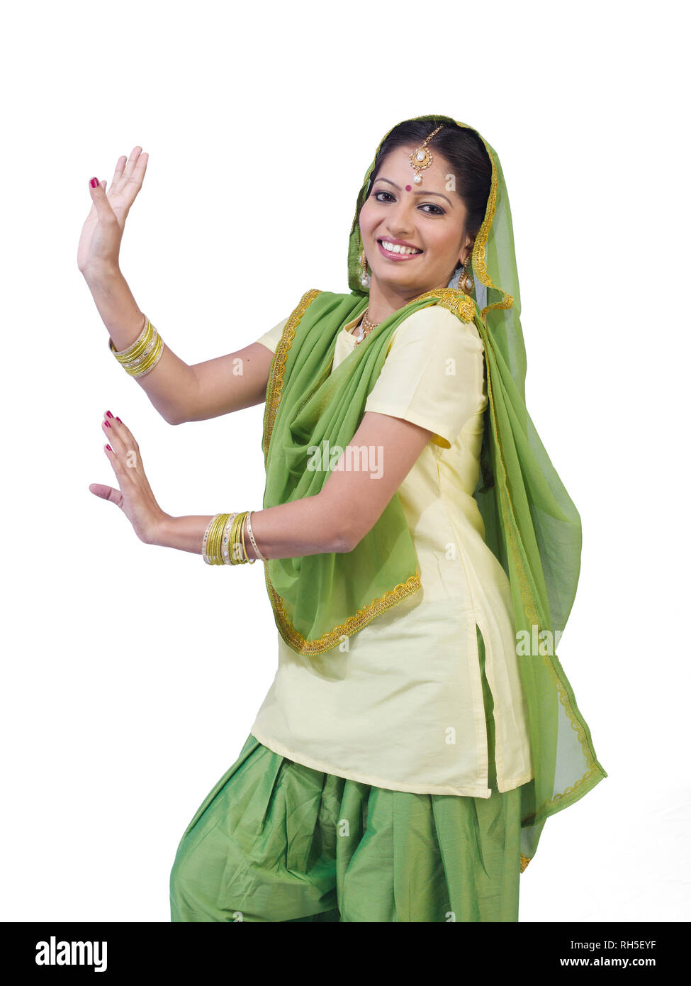 PORTRAIT OF A SARDARNI, SIKH WOMAN  DANCING THE BHANGRA Stock Photo
