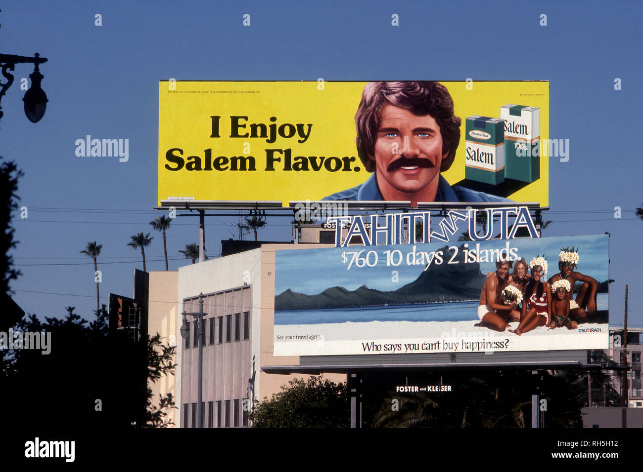 Commercial billboards in Los Angeles advertising cigarettes and travel to Tahiti circa 1970s Stock Photo