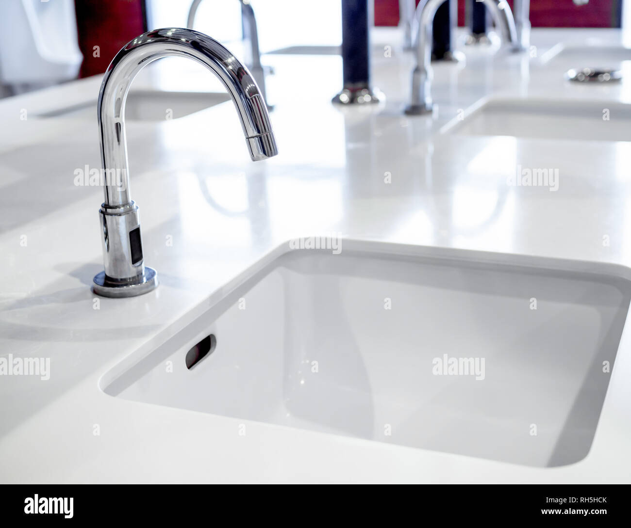 Stainless Steel Faucet On White Sink Decoration In Public Men