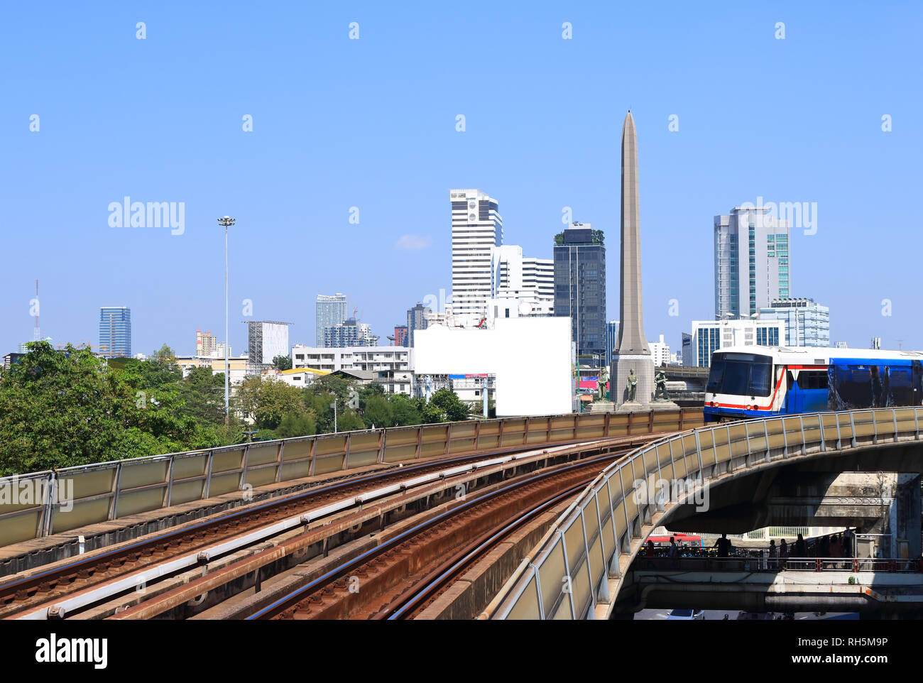 cityscape around victory monument, one of well known landmarks of bangkok, view from sky train station Stock Photo