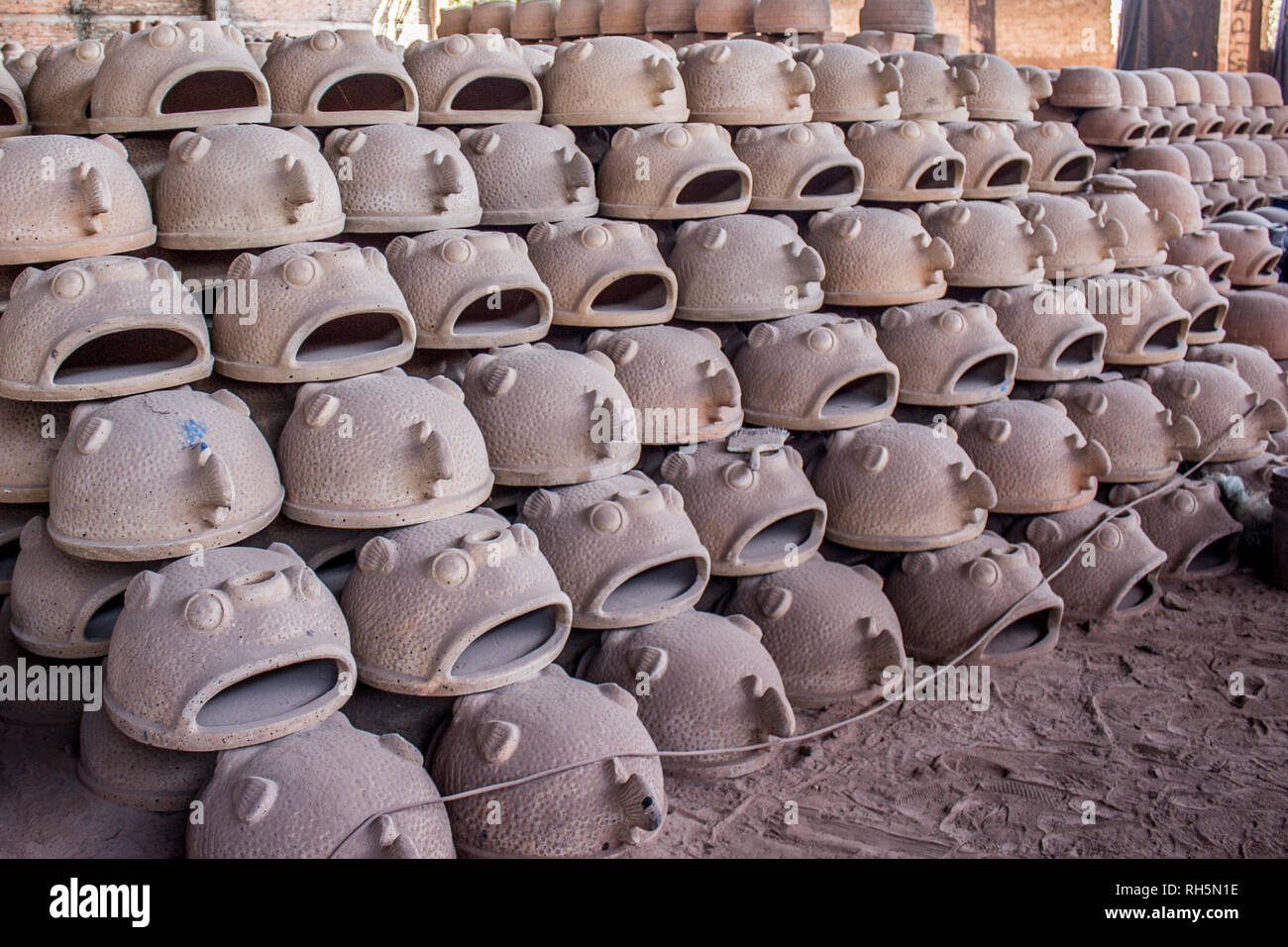 Pizza ovens drying in the shape of fish crafted by hand in Mexico Stock Photo