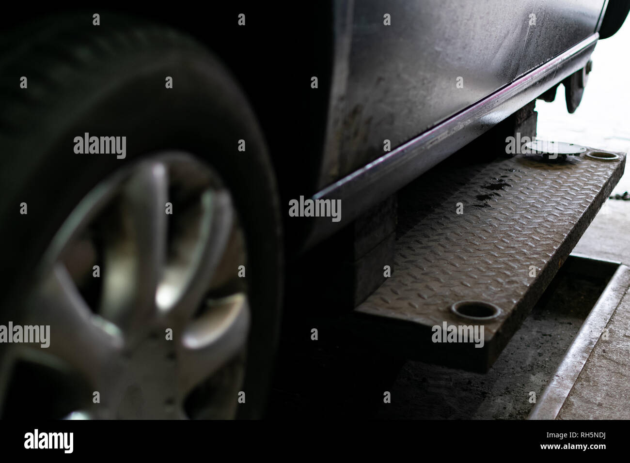 Seasonal tire change in a passenger car Stock Photo Alamy