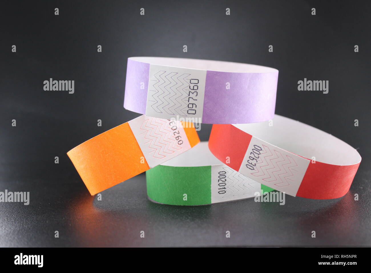 Colorful Tyvek wristbands for concerts, events and music festivals Stock Photo
