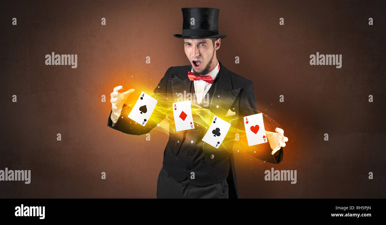 Illusionist in tails bandy play cards between his two hands Stock Photo ...