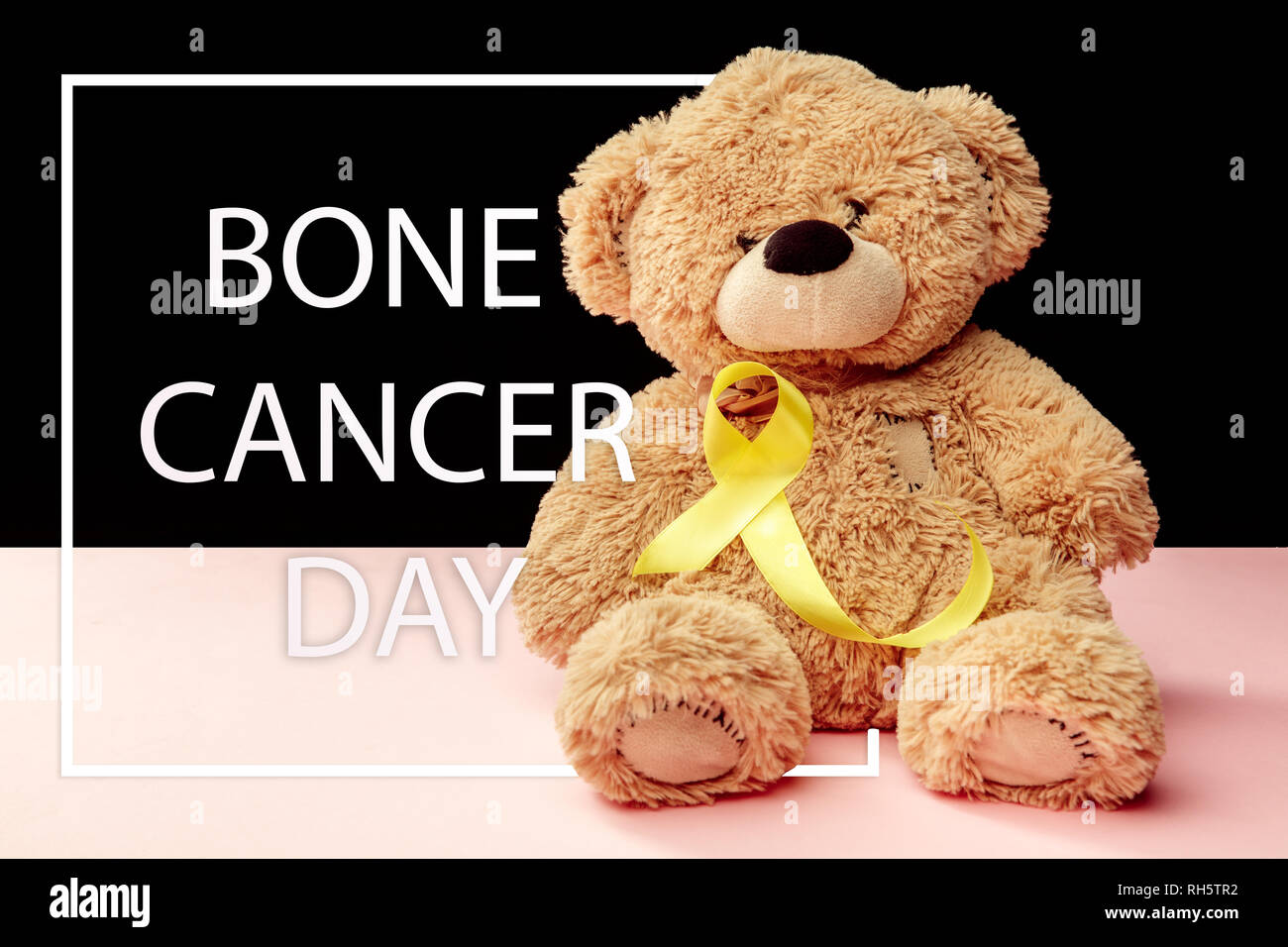 Yellow ribbon symbolic color for Sarcoma Bone cancer awareness and suicide prevention with toy bear. The cancer, health, help, care, support, hope, illness, healthcare concept Stock Photo