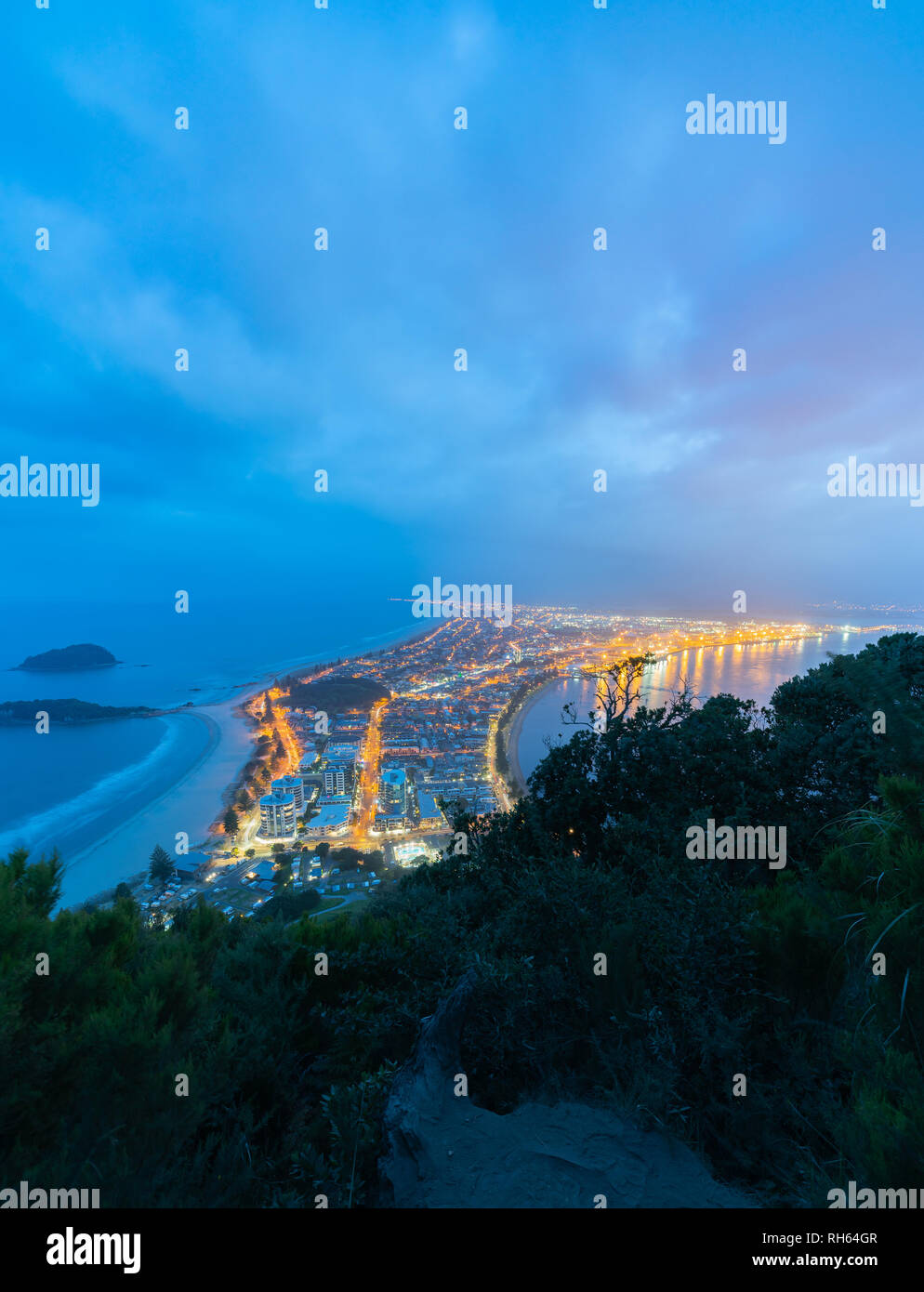 Urban night lights from top of landmark Mount Maunganui a popular