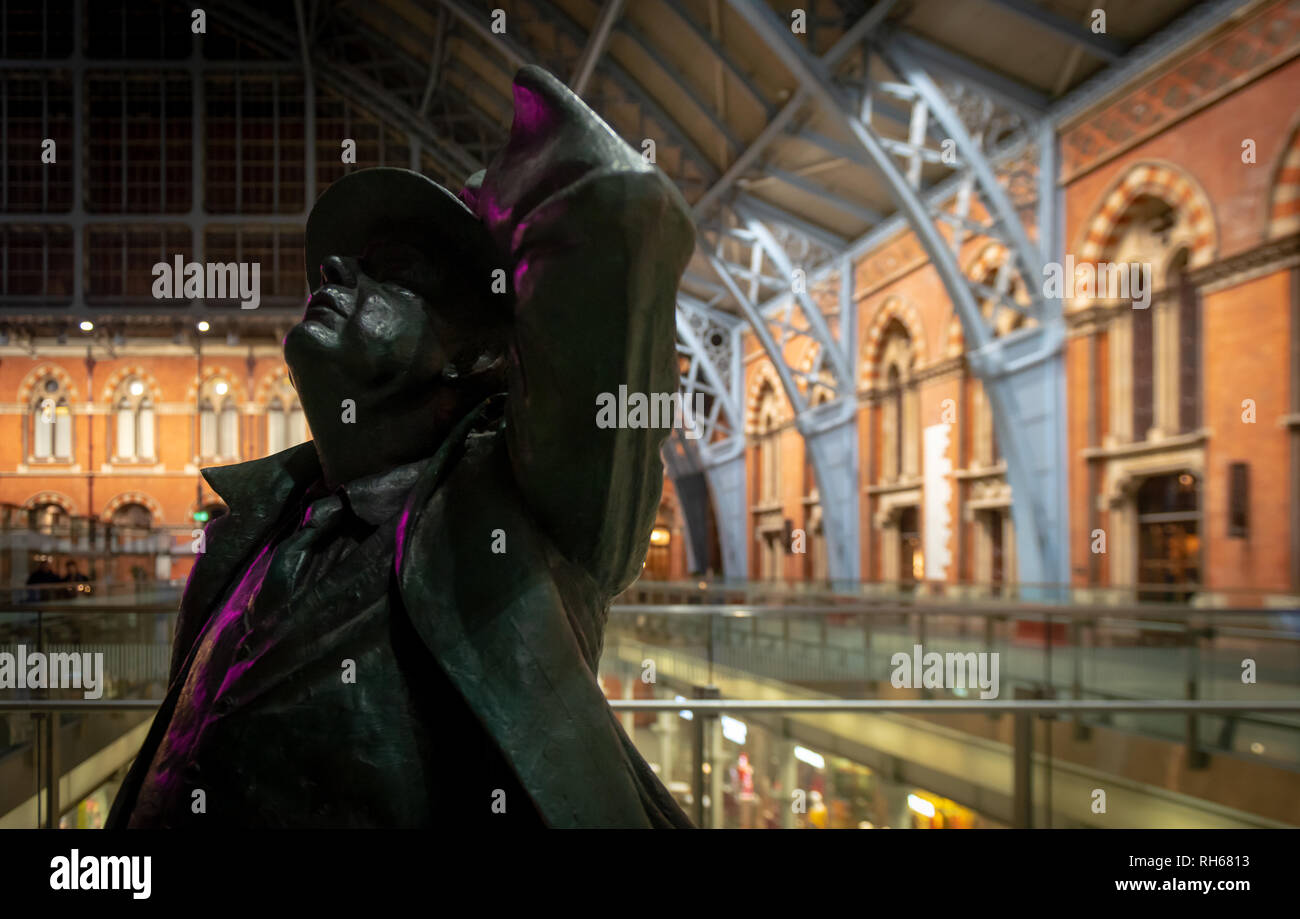 St Pancreas International railway station in London. The sculpture of a travelling gentleman while zero people are in the image Stock Photo