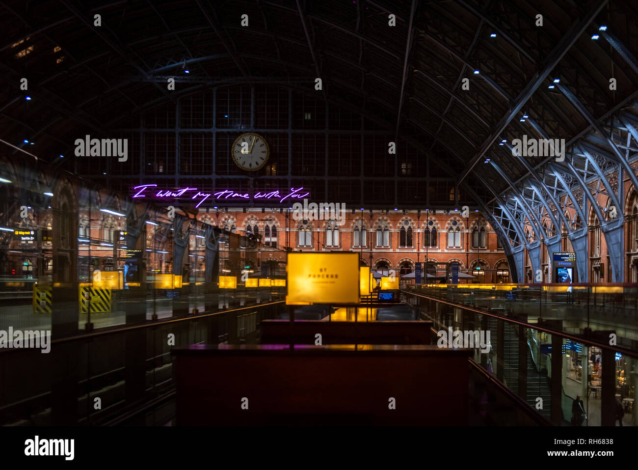 St. Pancreas International train station and the neon sign reading 'I want my time with you' with no people in the image Stock Photo