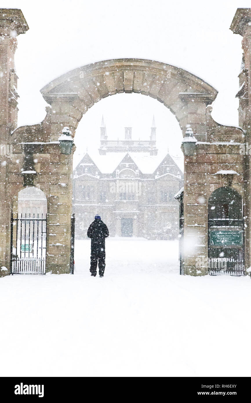 Corsham, Wiltshire, UK. 1st February, 2019. Heavy snowfall blankets the ancient town centre, home to the TV series Poldark and now a wintery scene which was forecast, though arrived late and much heavier than earlier predictions. Local residents brave the cold conditions as heavy snowfall continues to accumulate   throughout the day - with revised forecasts reporting sustained snow until 6pm this evening. The roads   are empty of cars, many schools and business remain closed whilst the wintery weather continues it's icy   grip in Wiltshire. Credit: Wayne Farrell/Alamy Live News Stock Photo