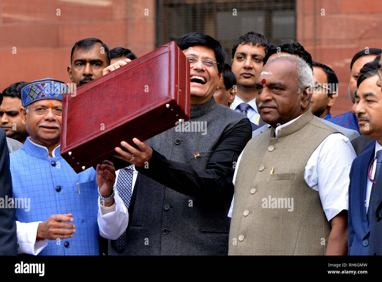 New Delhi, India. 1st Feb, 2019. Indian Finance Minister Piyush Goyal(C) holds a briefcase containing federal budget documents as he leaves his office for the parliament house in New Delhi, India, on Feb. 1, 2019. Credit: Partha Sarkar /Xinhua/Alamy Live News Stock Photo