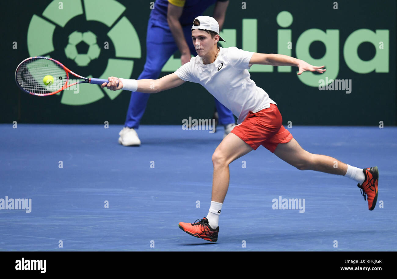 01 February 2019, Hessen, Frankfurt/Main: Tennis: Davis Cup, qualification  round Germany - Hungary in the Fraport Arena. Hungary's Zsombor Piros  strikes in the first singles against the German Kohlschreiber. Photo: Arne  Dedert/dpa